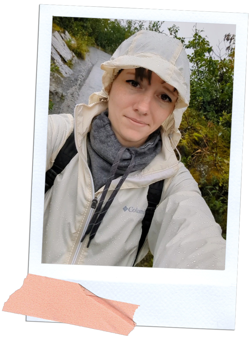 Gabi, The Fringe Explorer, in a rain jacket stuck in the rain