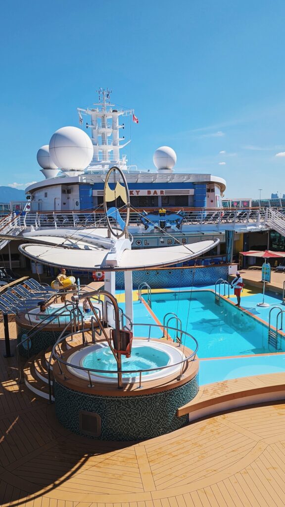 View of the pool, hot tubs, and sky bar from above on Serenade of the Seas