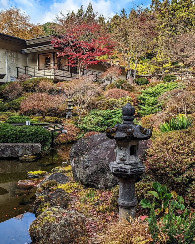 Inner courtyard of Okunoin Hotel Tokugawa - A Japanese Garden with a small pond and colorful fall trees