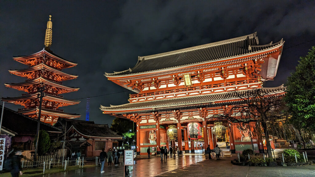 five story pagoda and hozomon gate at Sensoji shining bright red at night