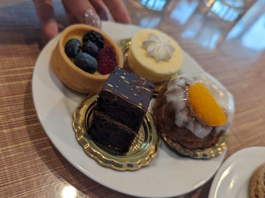 A plate of various desserts from the VIP Experience Buffet