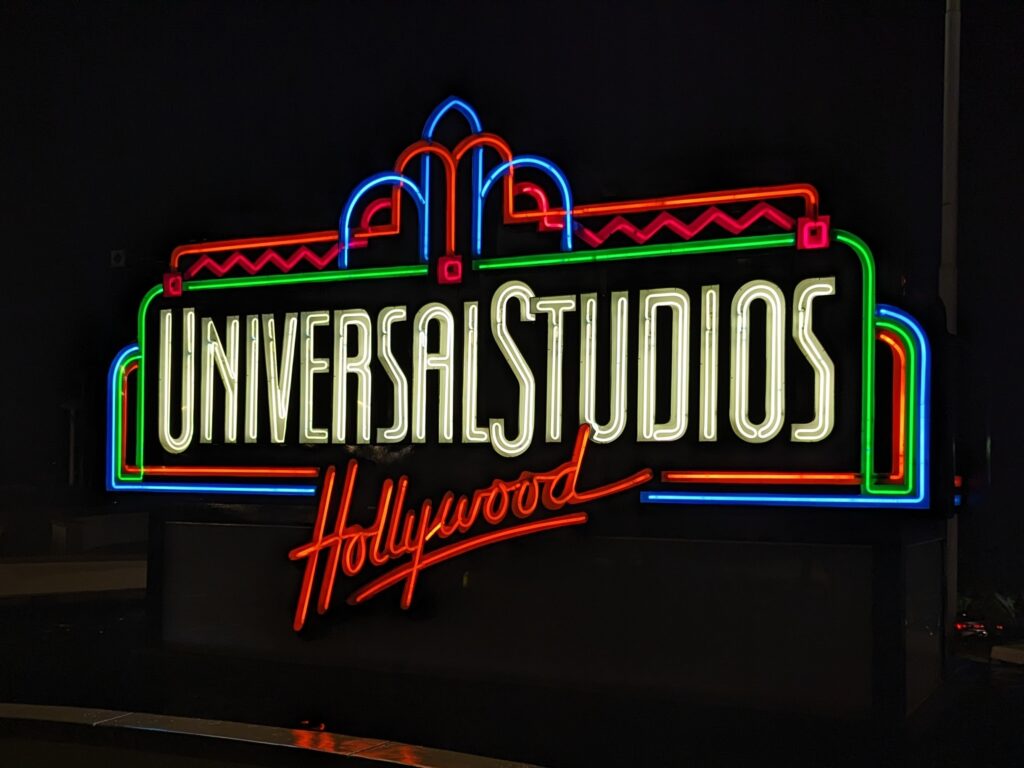 Universal Studios Hollywood sign glowing neon at night