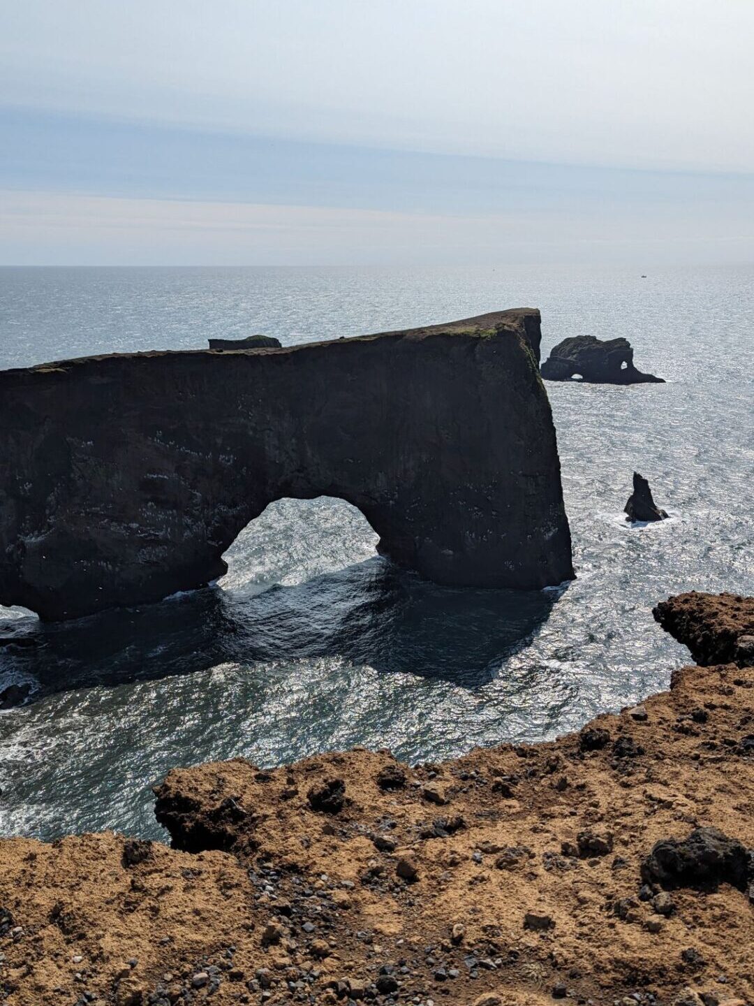 a natural rock arch in the ocean