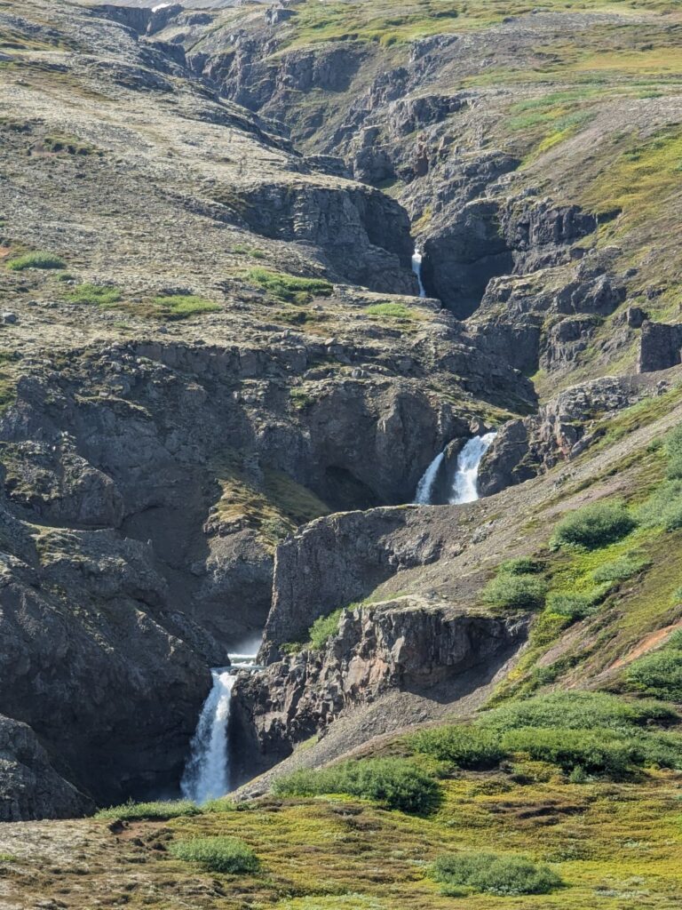 Waterfall cascading in multiple levels down a mountain side