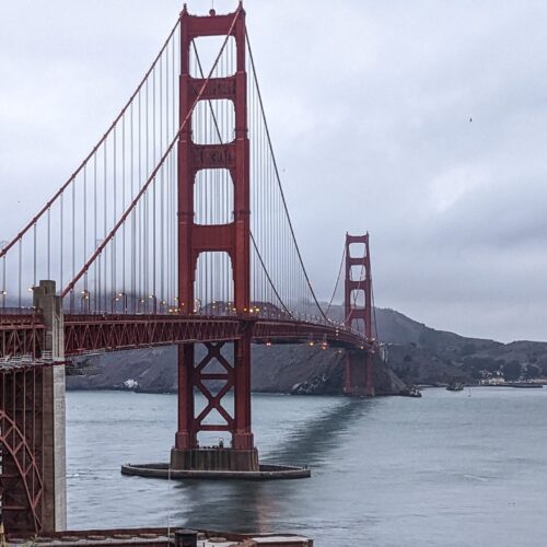 View of the Golden Gate Bridge from the visitors center on the west side of the bridge. The weather is cloudy and foggy.